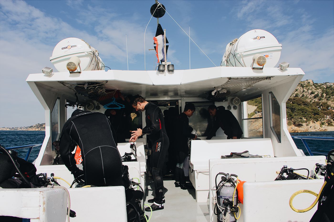 Cylinders and buoyancy jackets stacked on a boat deck